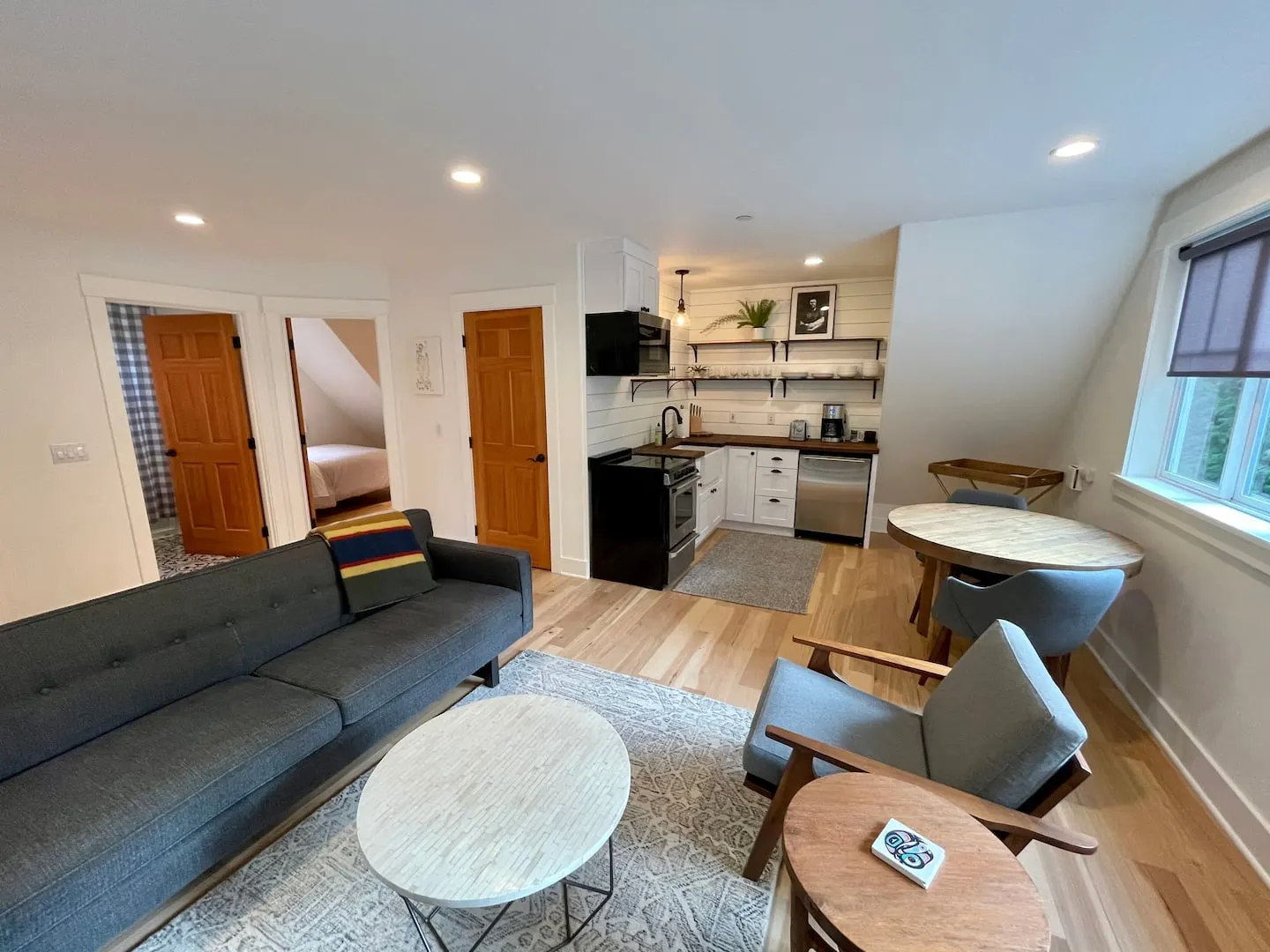 Living room, dining table and full kitchen in one open space