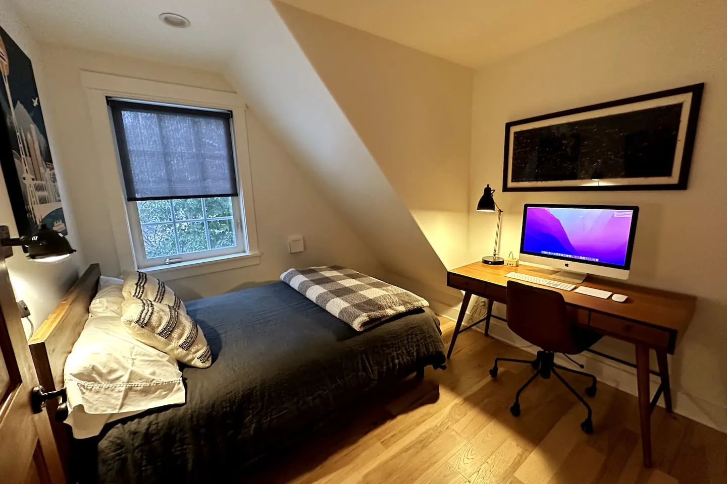 Second bedroom with a queen bed and a workspace desk with a 27-inch iMac